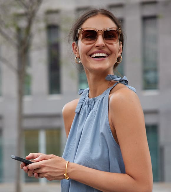 Woman wearing sunglasses with tri-focal lenses