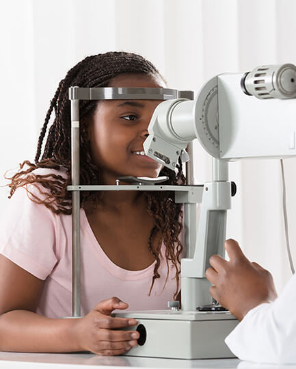 Girl undergoing advanced technology screenings at Premier Eyecare Associates