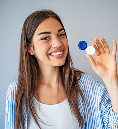 Woman holding scleral lenses