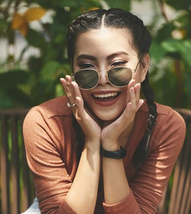 Woman wearing sunglasses with anti-reflective coating